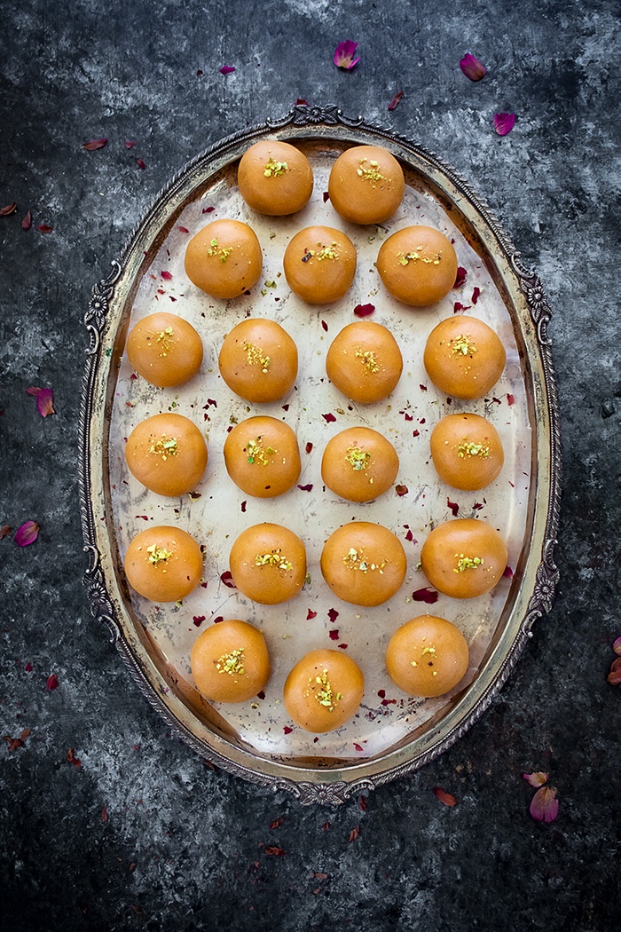 Freshly shaped besan laddu on a plate