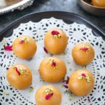 Besan ladoo garnished with rose petals