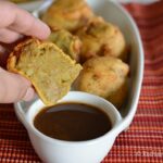 Alu Bonda dipping in sauce