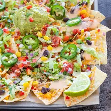 Loaded vegetable Nachos on a sheet pan