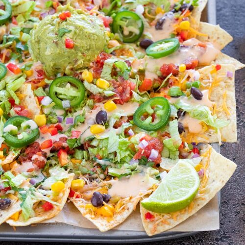 Loaded vegetable Nachos on a sheet pan