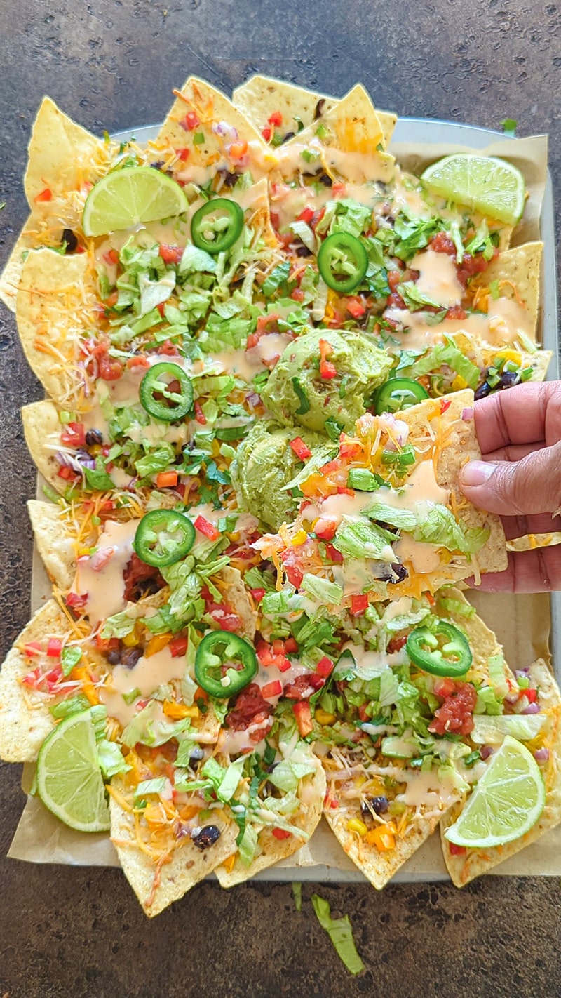 Sheet pan nachos enjoy them warm