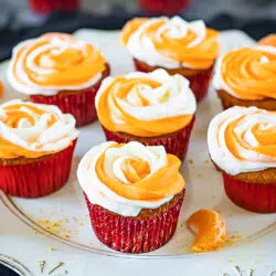 Frosted orange cupcakes eggless on a tray