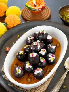 Black Gulab Jamun in a bowl