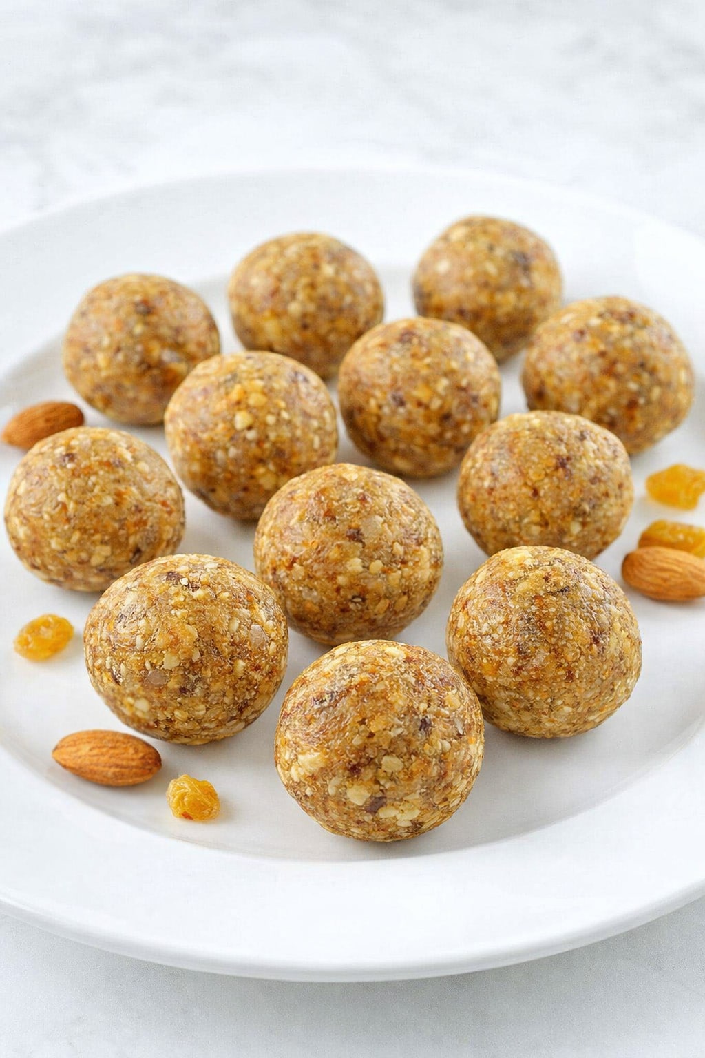 Homemade almond coconut energy balls topped with shredded coconut