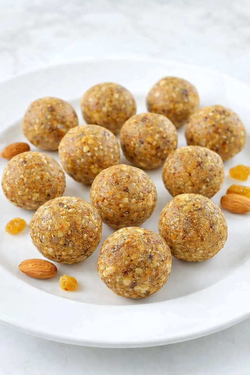 Homemade almond coconut energy balls topped with shredded coconut