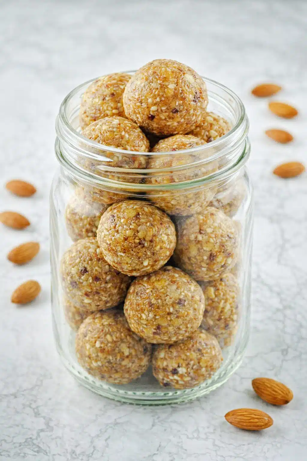 Easy vegan gluten free energy balls served in a white bowl on a napkin