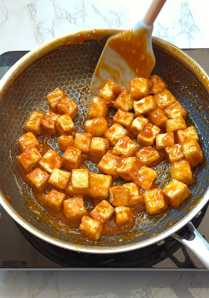 Coat tofu in sauce