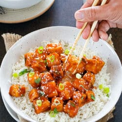 Stir-fried Sweet chili tofu garnished with scallions