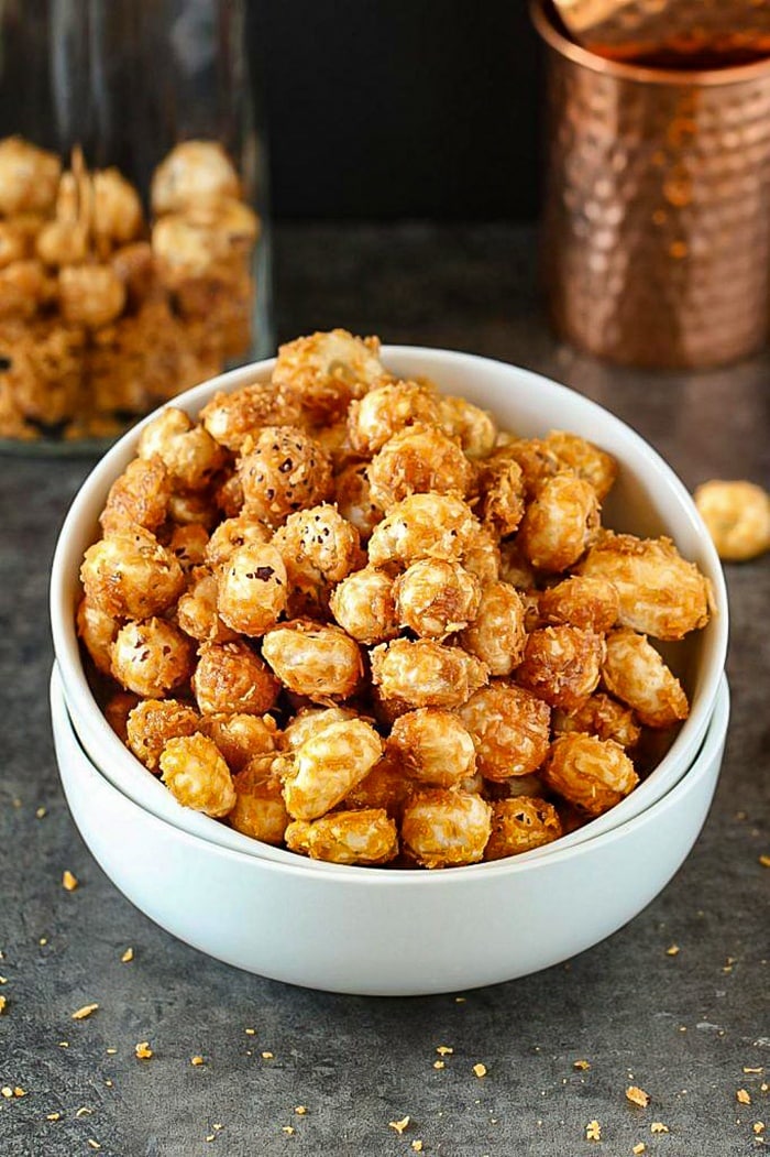 Gur Makhane or Jaggery Caramelized Lotus Seeds in a white bowl