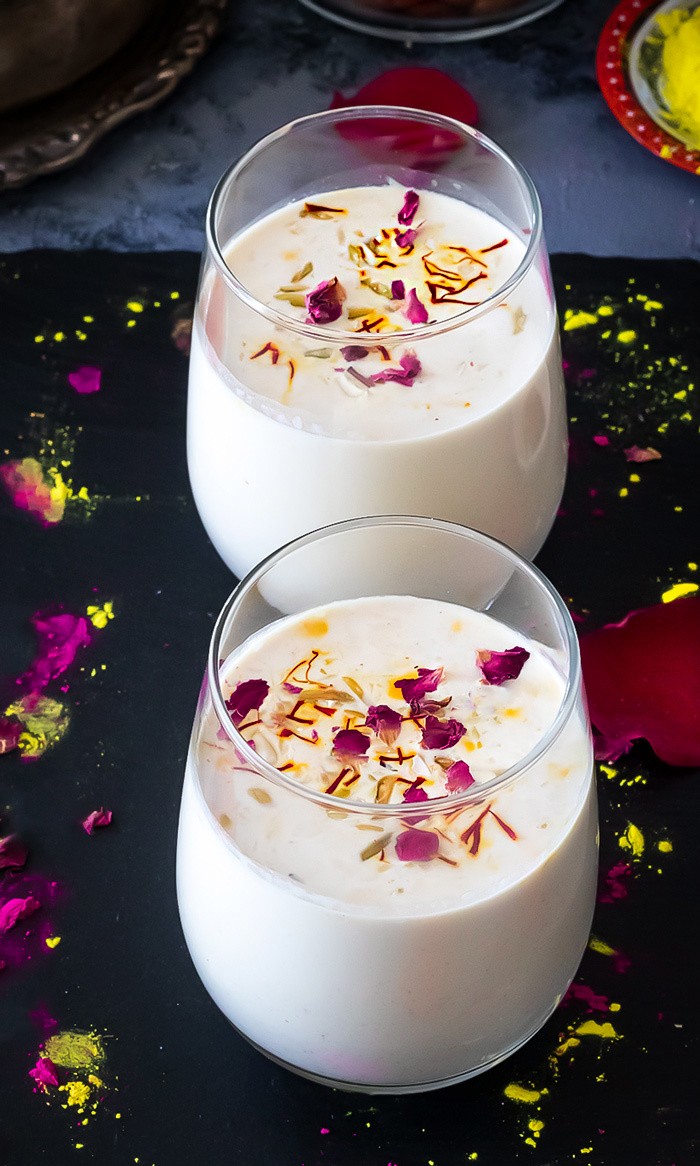 Sardai in glasses garnished with rose petals and saffron