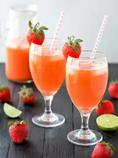 Fresh Strawberry Mint Lemonade served in tall glasses with lemon slices and mint leaves
