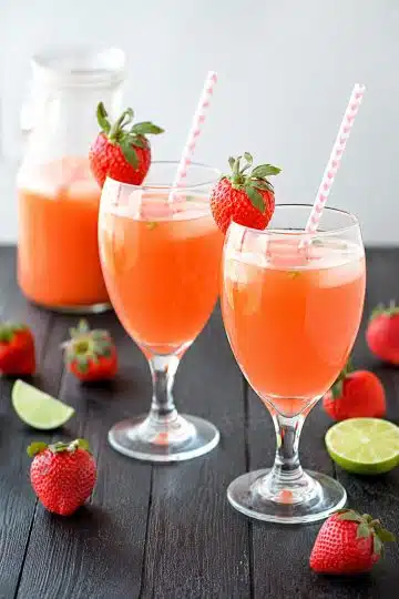 Fresh Strawberry Mint Lemonade served in tall glasses with lemon slices and mint leaves