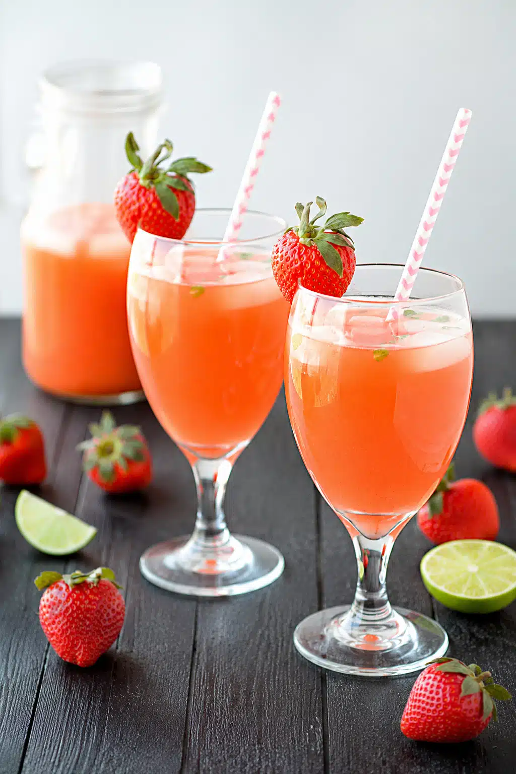 Fresh Strawberry Mint Lemonade served in tall glasses with lemon slices and mint leaves