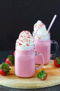 Strawberry Coconut Shake dressed up with whipped cream frosting