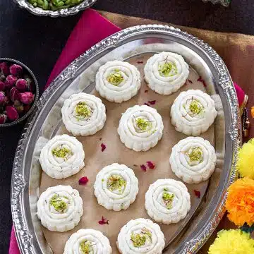 Milk Pedas on a tray garnished with pistachios