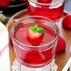 Vegan Strawberry Jelly set in serving cups garnished with mint leaves