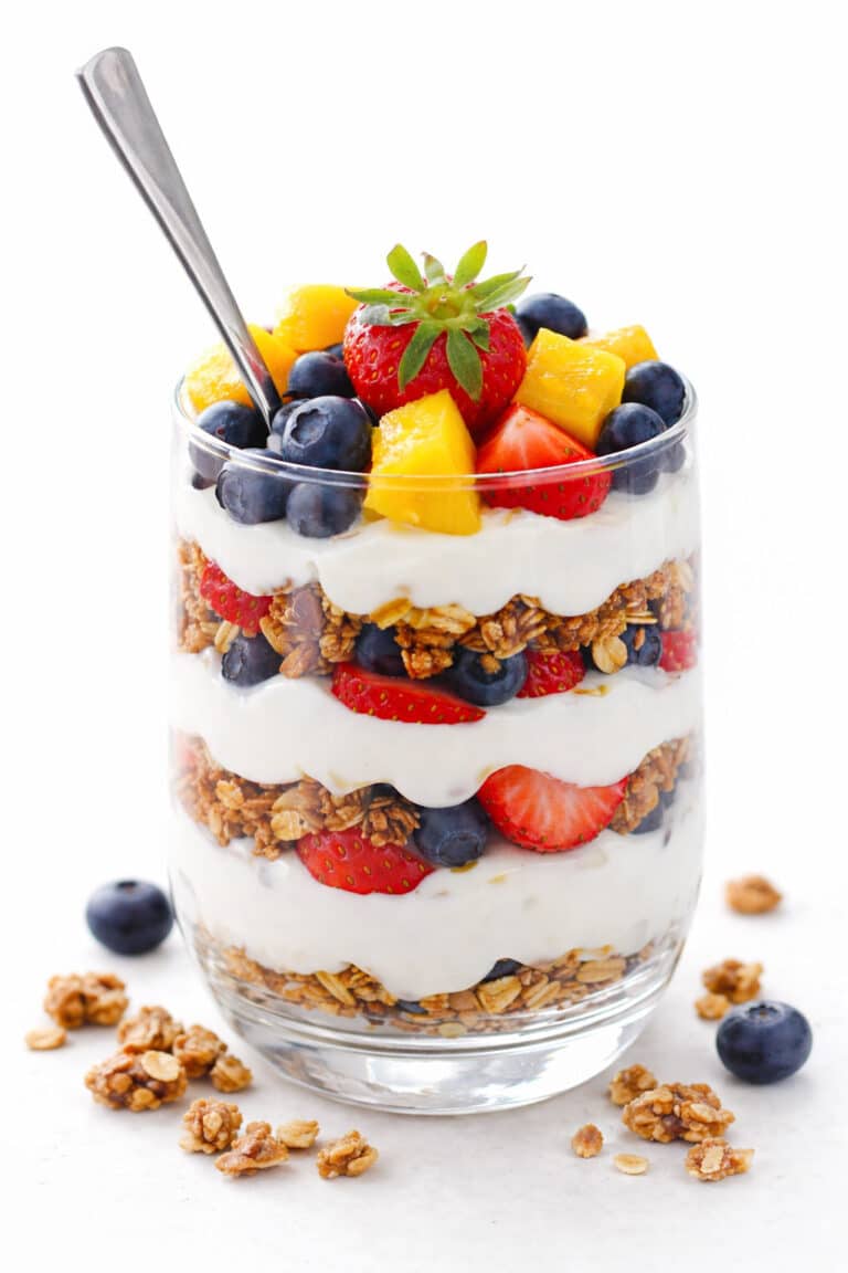 Homemade berry yogurt parfait topped with crunchy granola and fresh fruit