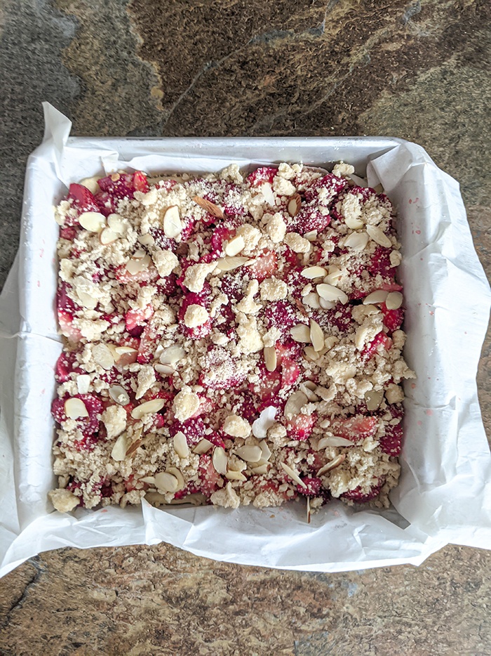 Spread crumble topping on the strawberries