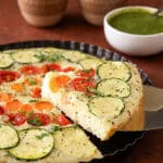 Vegetable semolina quiche with zucchini, tomatoes, carrots, and onions