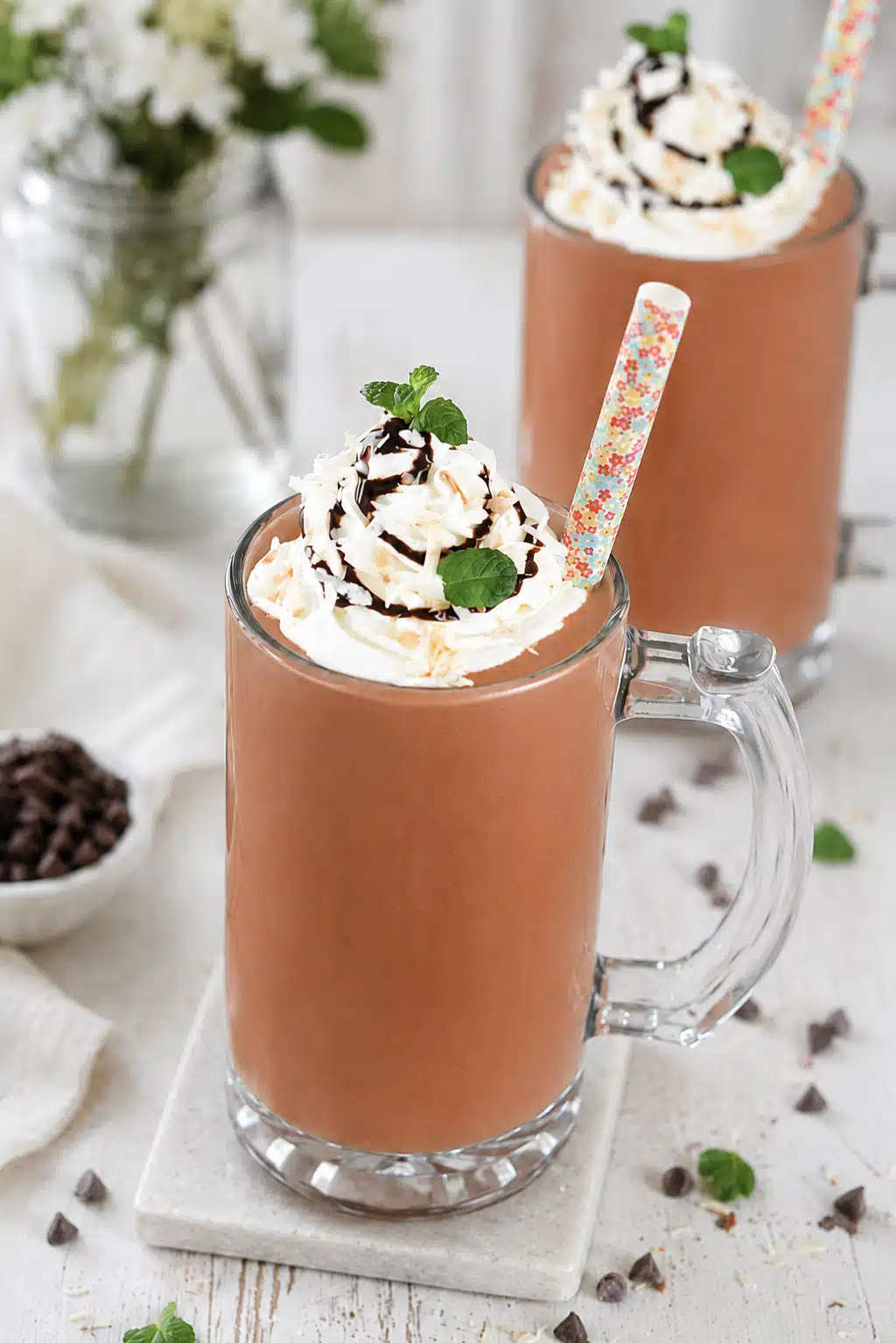Dark Chocolate Coconut Cooler with straw and served with whipped cream
