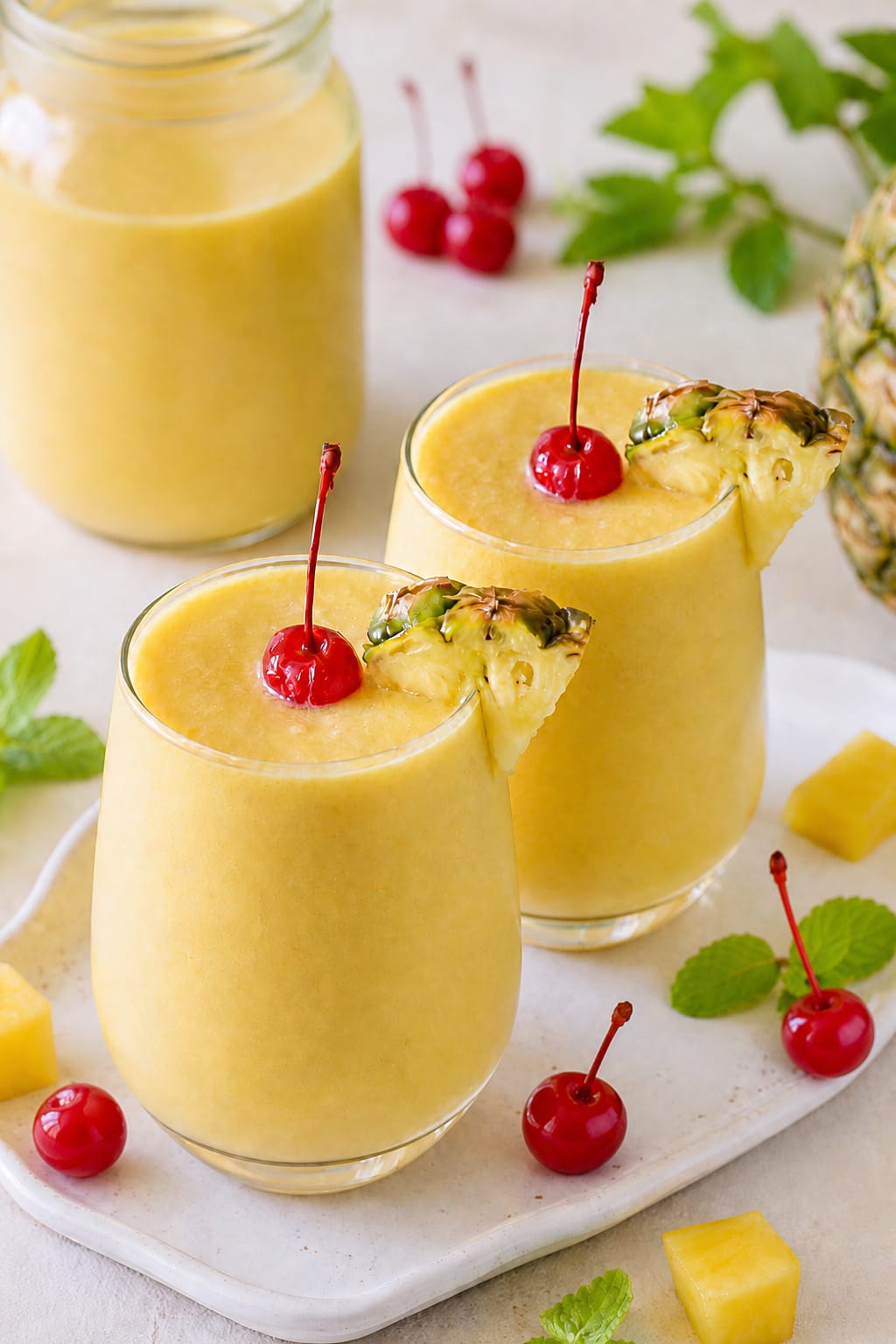 Virgin Pineapple Mango mocktail made with mango puree, pineapple juice, and coconut cream