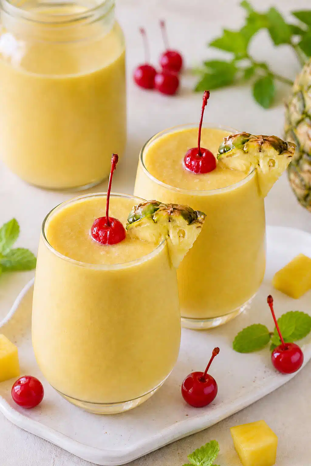 Virgin Pineapple Mango mocktail made with mango puree, pineapple juice, and coconut cream