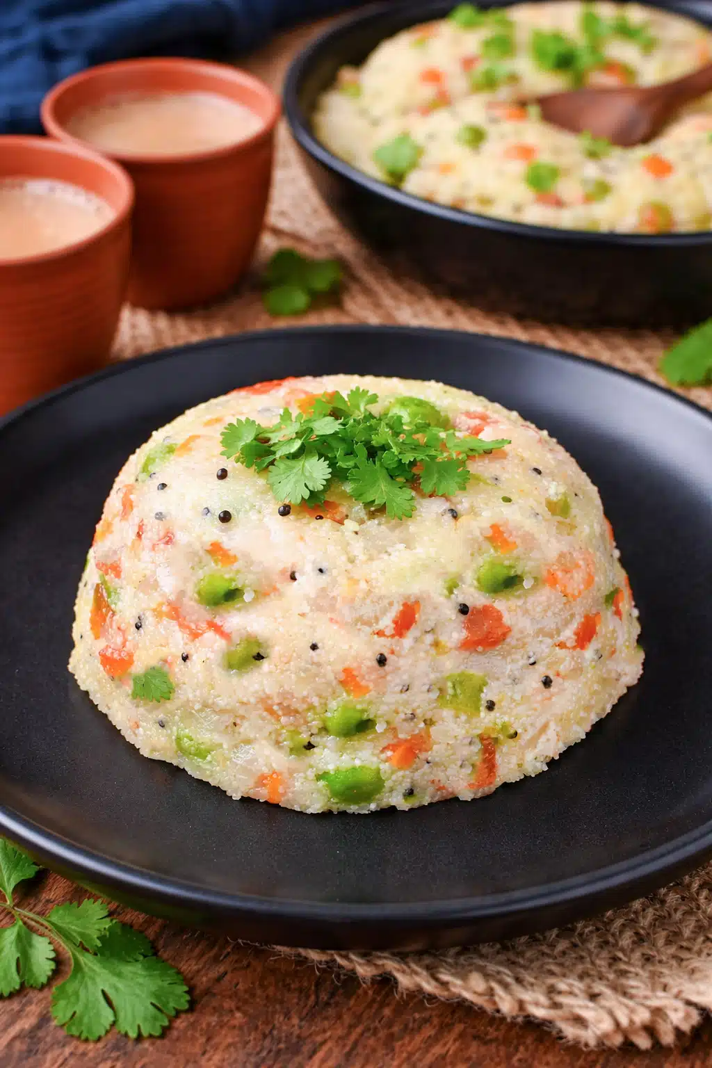 Rawa Upma garnisher with green peas and cilantro leaves