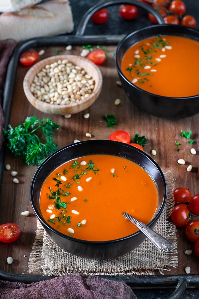 Instant Pot Roasted Bell Pepper And Tomato Bisque in a bowl with spoon