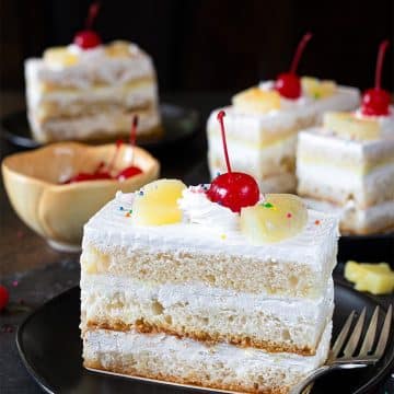Layered eggless Pineapple pastry topped with cherry
