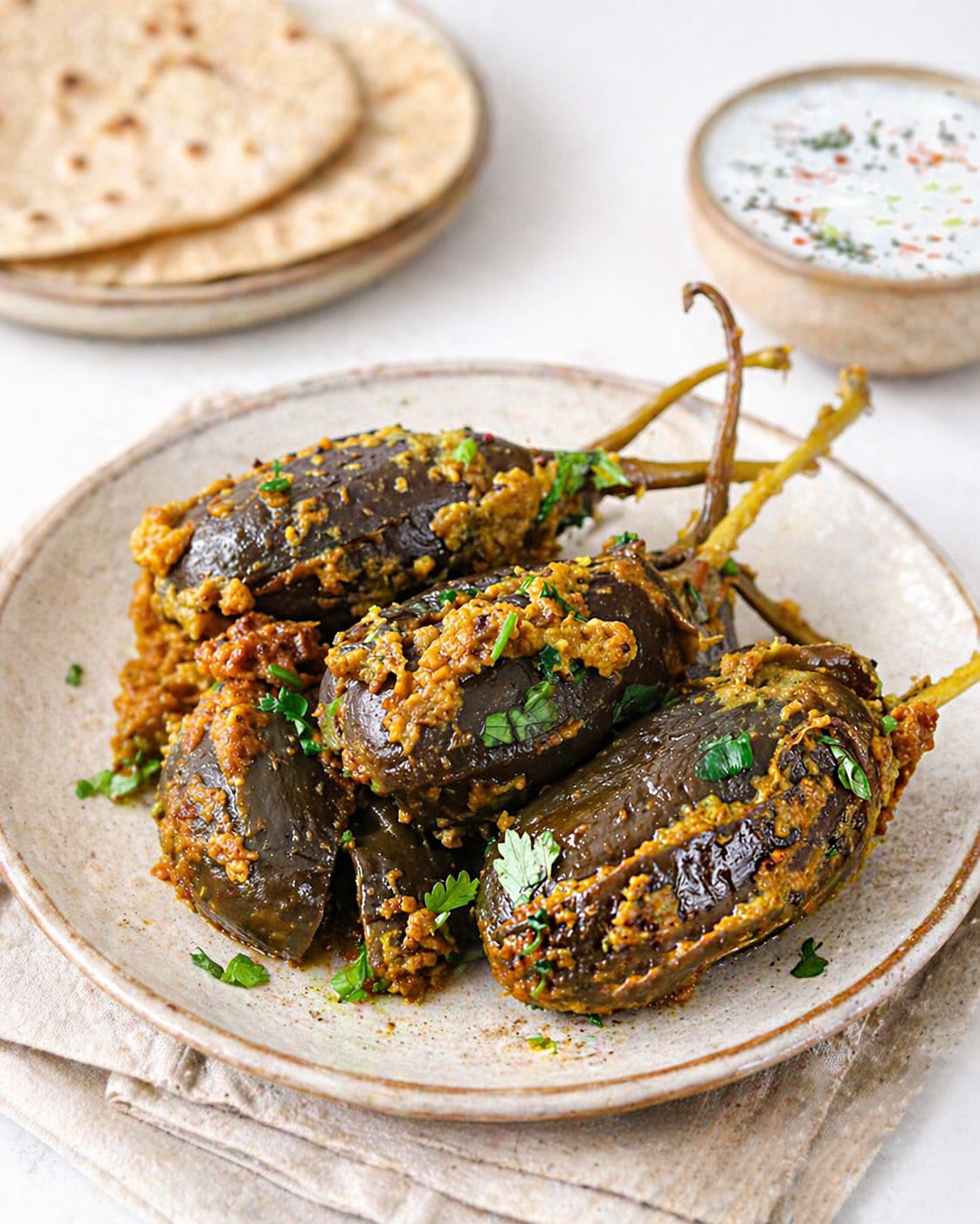 Tender baby eggplants filled with spicy peanut masala for Instant Pot Bharwan Baingan