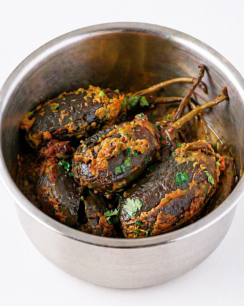 Vegan stuffed baby eggplants served as a flavorful Indian brinjal curry for roti or rice