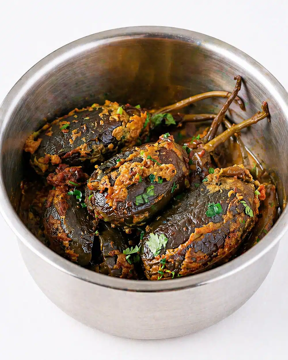 Vegan stuffed baby eggplants served as a flavorful Indian brinjal curry for roti or rice