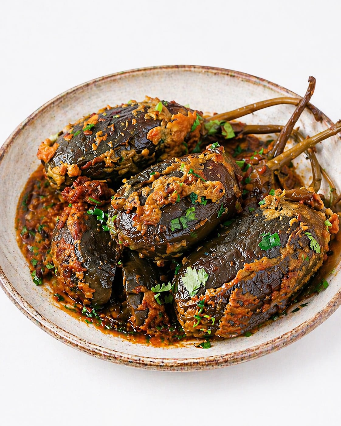 Bharwa Baingan cooked in tomato coconut masala