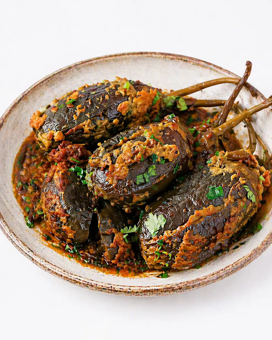 Bharwa Baingan cooked in tomato coconut masala