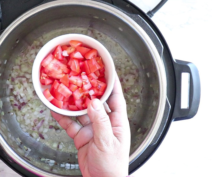 Add tomatoes and cook