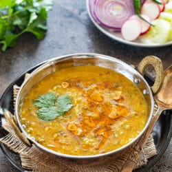 Instant Pot Panchmel dal with rice and onions in a bowl