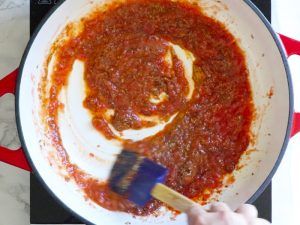 Cook tomato puree and spices