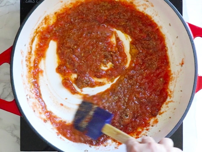 Cook tomato puree and spices