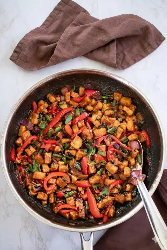 Thai Basil Tofu Stir fry cooked in a pan