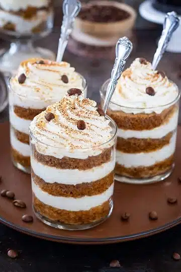 Eggless Tiramisu Trifle Cups on a brown plate