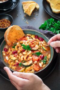 Instant Pot Minestrone soup with a slice of bread