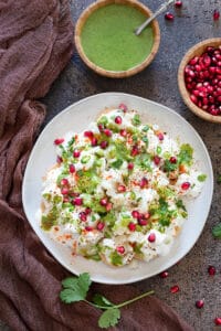 Vrat papdi chaat on a plate laced with chutney