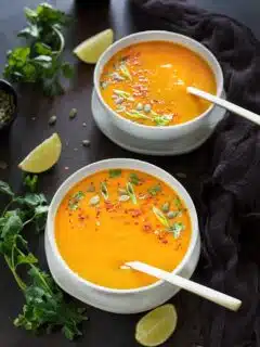 Instant Pot Thai Butternut Squash Soup with cilantro and lemon wedges