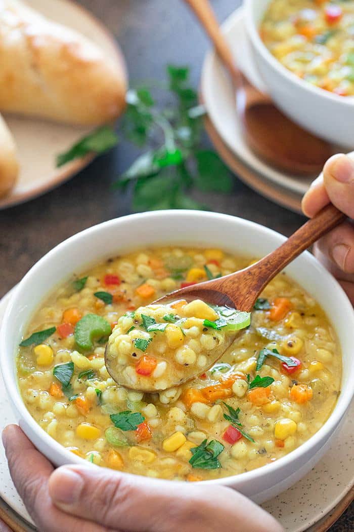 Instant Pot Barley Lentil Vegetable Soup in a bowl with spoon
