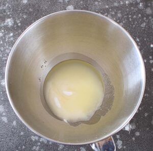 Cream oil + sugar together