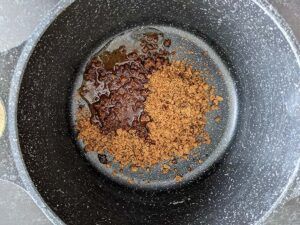 Jaggery and water in a pan