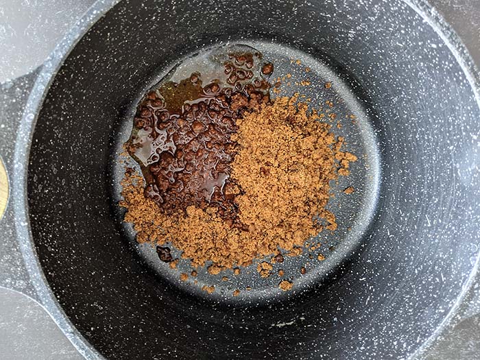 Jaggery and water in a pan