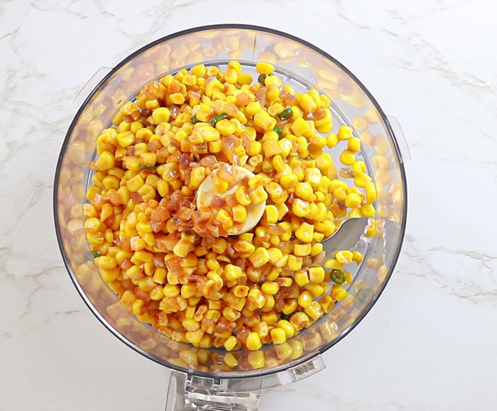 Grind corn kernels in the food processor