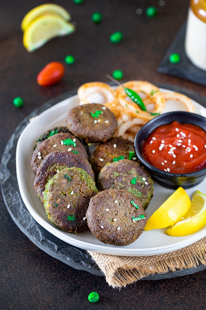 Hara Bhara Kabab served with ketchup on a plate